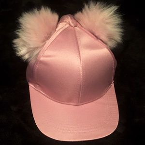 Pink hat with puffs on top